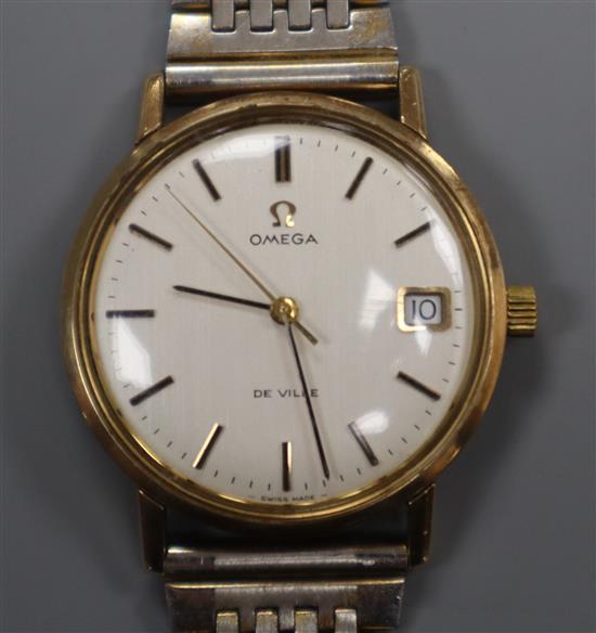 A gentlemans gold plated Omega De Ville manual wind wrist watch, on associated bracelet.